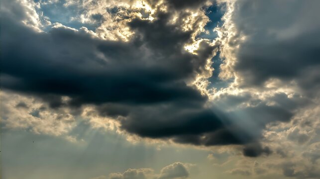 Dramatic sky with sunrays and clouds
