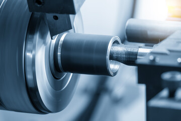 The multi tasking CNC lathe machine Swiss type bore cutting process the metal tube parts in the light blue scene.