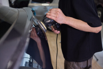 Experience the Art of Professional Car Detailing with a Polishing Tool in Action Today