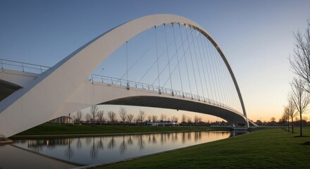 Modern arch bridge spans tranquil waterway