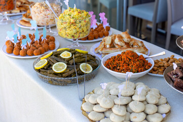 Outdoor catering buffet with a variety of food snacks and appetizers