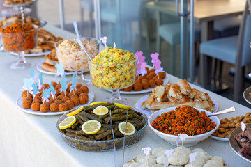 Outdoor catering buffet with a variety of food snacks and appetizers