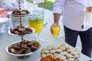 Outdoor catering buffet with a variety of food snacks and appetizers