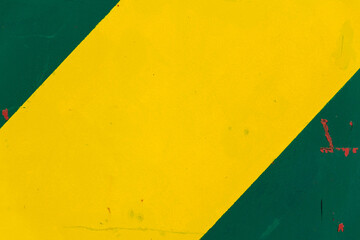 Yellow and green sheet metal background with transverse stripes