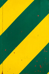 Yellow and green sheet metal background with transverse stripes