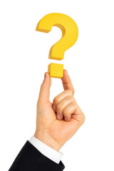 A hand holding a yellow question mark. Concept of curiosity and uncertainty. The question mark is a symbol of asking for information or seeking answers