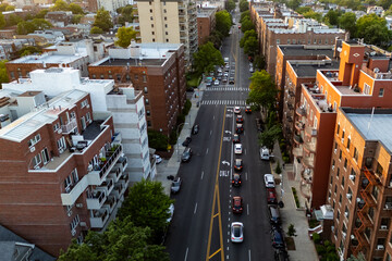 Cityscape from above, buildings and roads sprawled out below.
