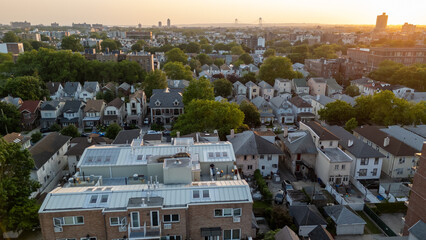 Cityscape from above: bustling streets, tall buildings, and busy traffic create a vibrant urban scene.