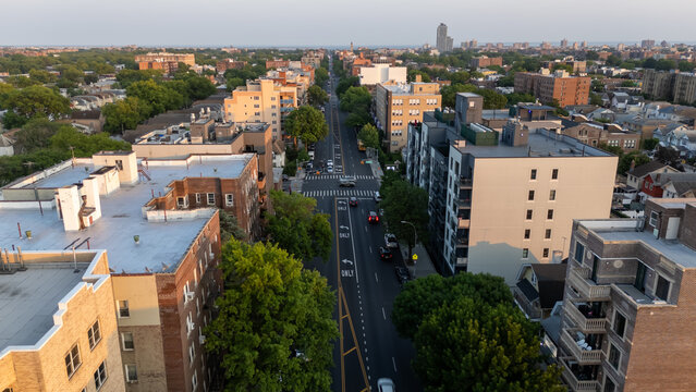 Busy city street with cars and buildings.