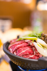 Sukiyaki of high quality Japanese beef at izakaya on the table