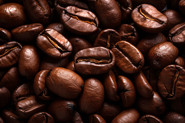 Close-Up View of Roasted Coffee Beans Showing Detailed Texture and Rich Tones