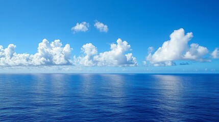 Obraz premium Summer sea level with blue sky and white clouds, serene and vast natural scenery background