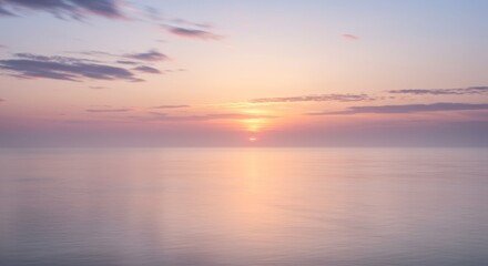 Fototapeta premium Pastel Sunset Over Calm Ocean Water