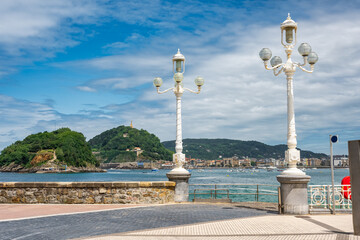 White and retro-style lampposts that adorn the promenade of La Concha Bay, San Sebastian.