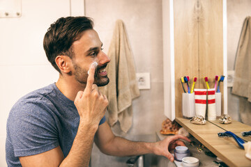 Man Doing Applying Cream On Face