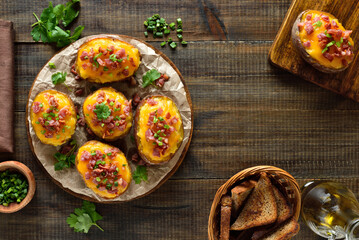 Baked stuffed potatoes with bacon, green onion and cheddar cheese