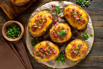 Baked stuffed potatoes with bacon, green onion and cheddar cheese