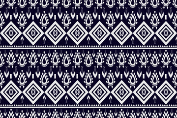 Traditional Thai tribal seamless pattern with geometric and ethnic motifs in navy blue and white, perfect for fabric, wallpaper, and textile design. Seamless pattern, tribal pattern, ethnic pattern.
