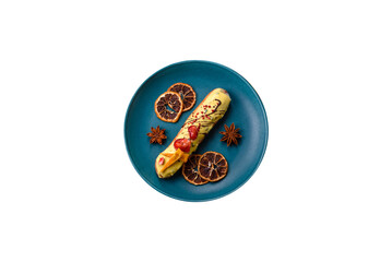French food, dessert eclair with chocolate filling. Eclair as a background