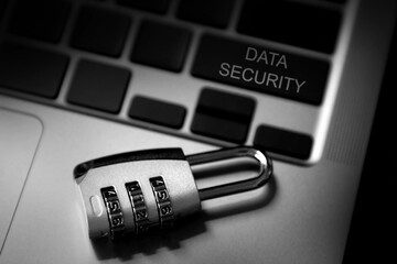 Data security and data protection concept; safety code padlock on laptop computer