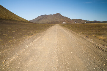 Lonely gravel road in the icelandic highland