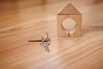 house keys on wooden background. concept of concluding transactions for sale or purchase of real estate