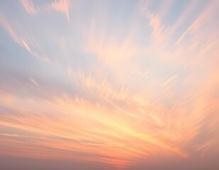 Obraz premium A sunset sky completely filled with streaks of cirrus clouds, painted in soft pastel colors, creating an abstract canvas. 