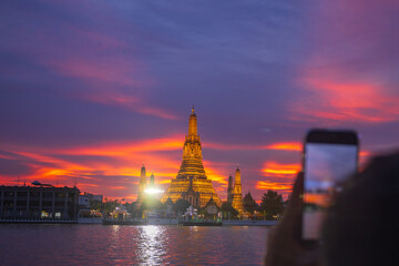 Twilight view of Wat Arun Ratchawararam Ratchawaramahawihan at sunset in bangkok Thailand. Landmark...