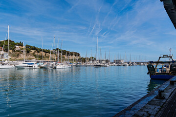 Arenys de Mar, Spain-June 08, 2025. Scenic view of the port of arenys de mar, Spain, sailboats moored in the background, showcasing the maritime activity of this coastal town