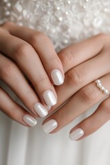 beautiful nail natural Elegant hands with manicured nails and a pearl ring, set against a soft, textured background.