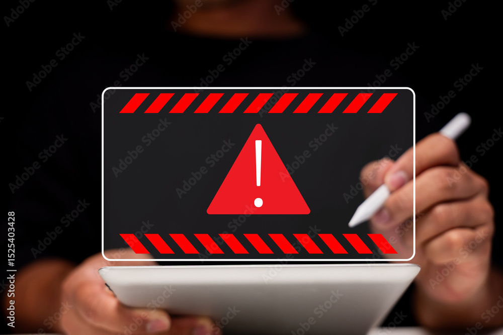 Poster a person uses a digital tablet with a prominent red warning alert symbol displayed on the screen.
