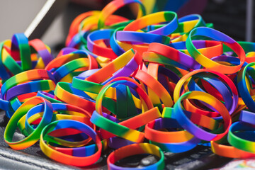 Pile of rainbow coloured rubber bracelets symbol of LGBTQ culture