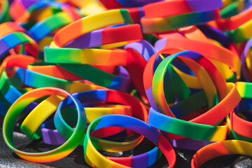 Pile of rainbow coloured rubber bracelets symbol of LGBTQ culture