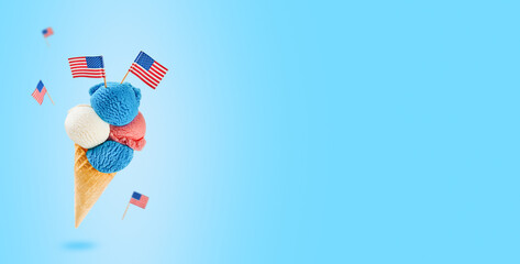4th of July Holiday background. Colorful ice cream cone with red, white and blue scoops patriotic colors flavors flying in air on blue background. Happy Independence Day concept. Mock up.