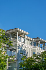 Top of modern apartment building with nice windows in Summer in Vancouver, Canada, North America. Day time on May 2025.