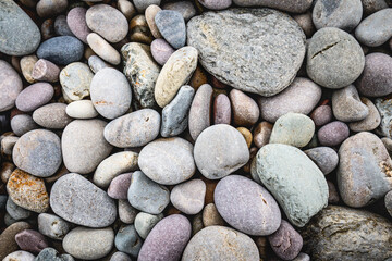 close up of colorful pebbles on the beach, natural pattern