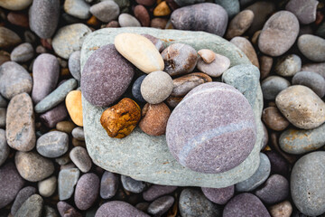 close up of colorful pebbles on the beach, natural pattern