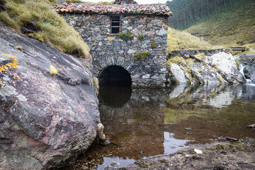 ancient mill beside the shore