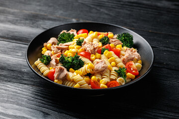 Tuna corn pasta salad with tomatoes and broccoli