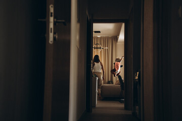 Cozy morning at home. A barefoot child in striped pajamas plays and spends time in a warm, inviting interior with natural light and a relaxed atmosphere.