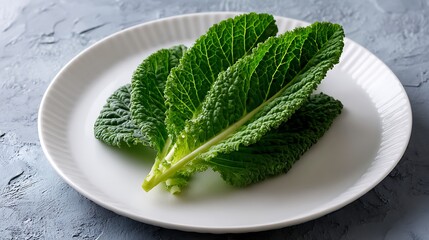 Fresh Kale Leaves on a White Plate