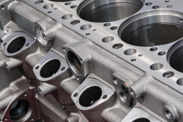Close-up of a disassembled silver car engine auto service concept background.