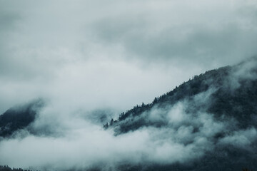 Moody photo of foggy hills after rain with clouds and hilltops in lower third