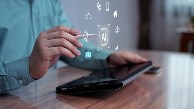 ฺBusinessperson interacting with AI-generated digital icons above a tablet screen. The image represents artificial intelligence, app integration, and modern digital tools.