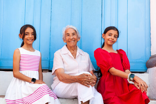 Grandmother and granddaughters traveling together.  Family love concept. Travel concept. Cartagena de Indias.