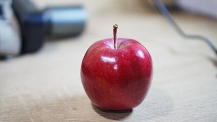 Fresh red apples just picked on the table at night