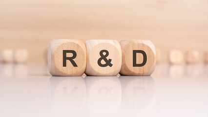 wooden cubes with R and D abbreviation on a smooth surface