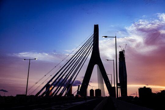 Abidjan at sunset featuring the iconic F Tower under construction from Alassane Ouattara Bridge. 2025.