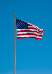 American Flag Waving in a Blue Sky