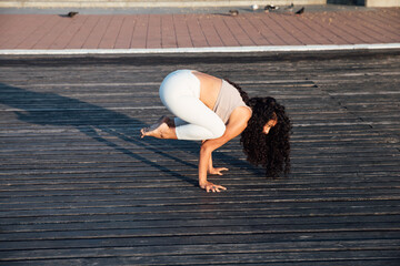 fitness woman brunette doing gymnastics yoga asana